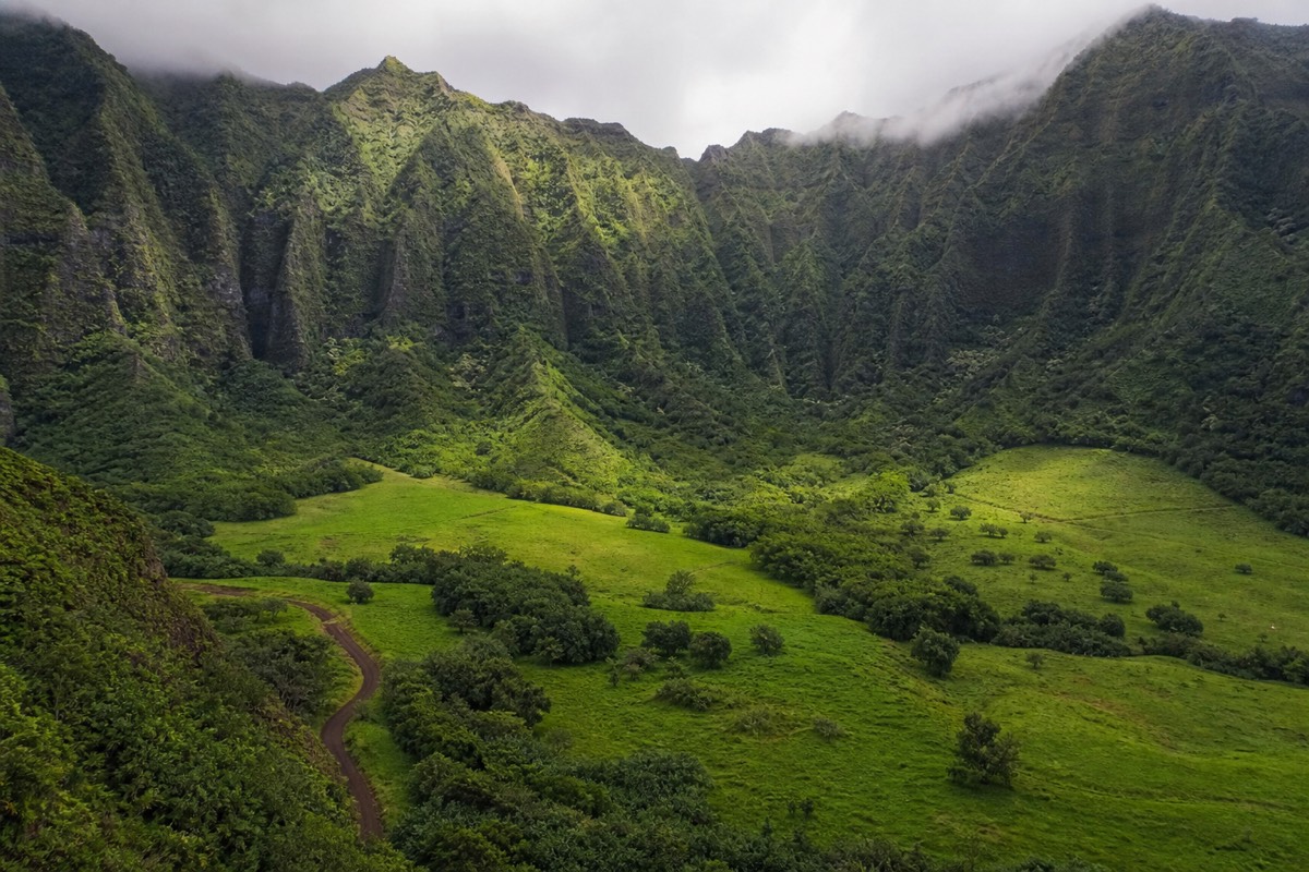 Horseback ride through open pastureland on Kauai's Maha'ulepu Heritage Trail