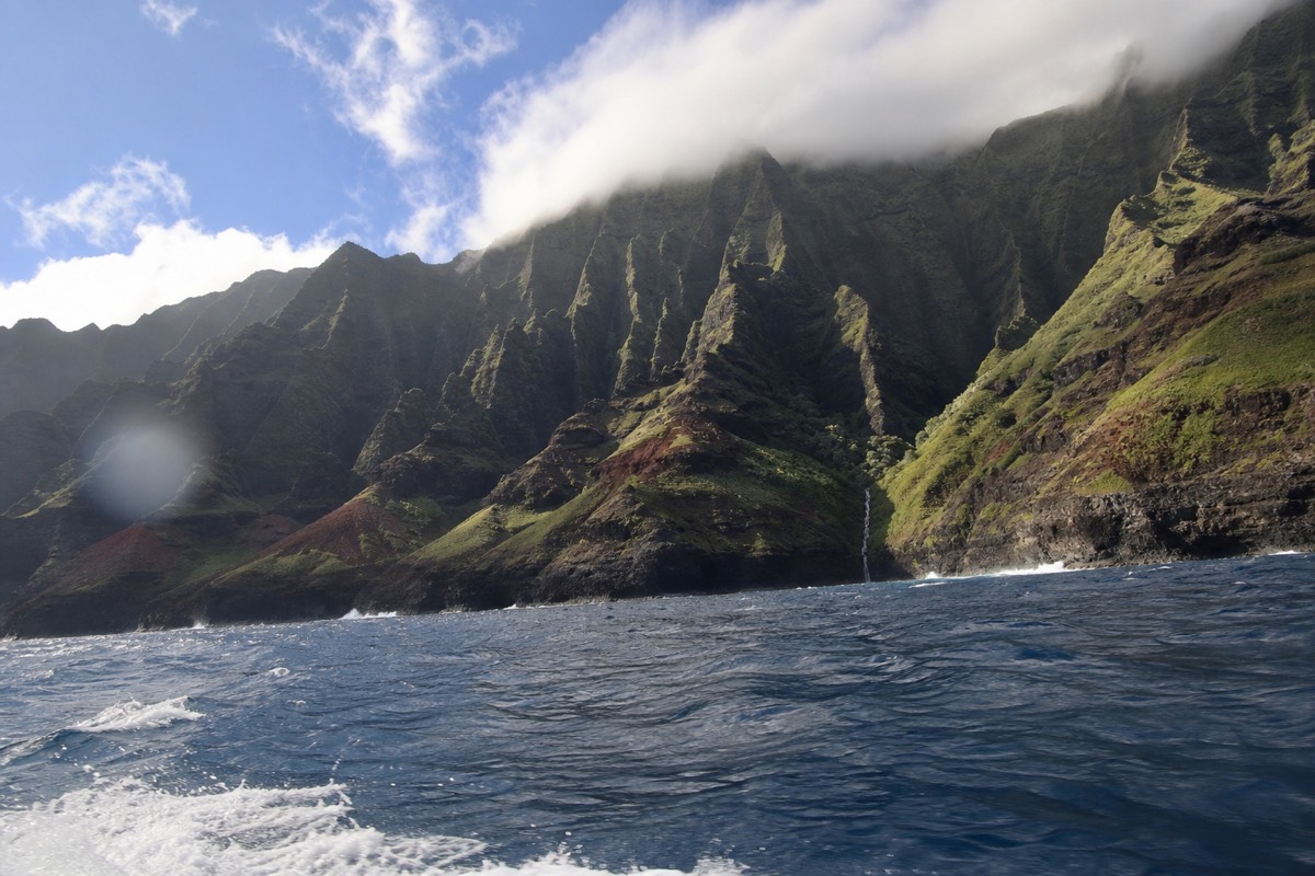 The Na Pali Coast cliffs seen from the water, beyond the reach of Kauai horseback tours